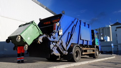 Commercial waste removal van parked outside a Barkingside high street shop