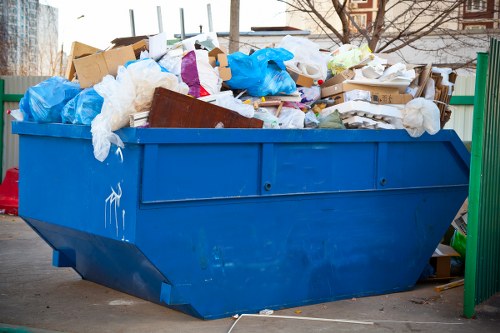 Workers sorting recyclables and non-recyclables during a commercial clearance